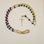 Rosario misionero con Medalla del Sagrado Corazón de Jesus de perfil y de la Virgen del Carmen, Crucifijo de Cristo crucificado con detalles florales