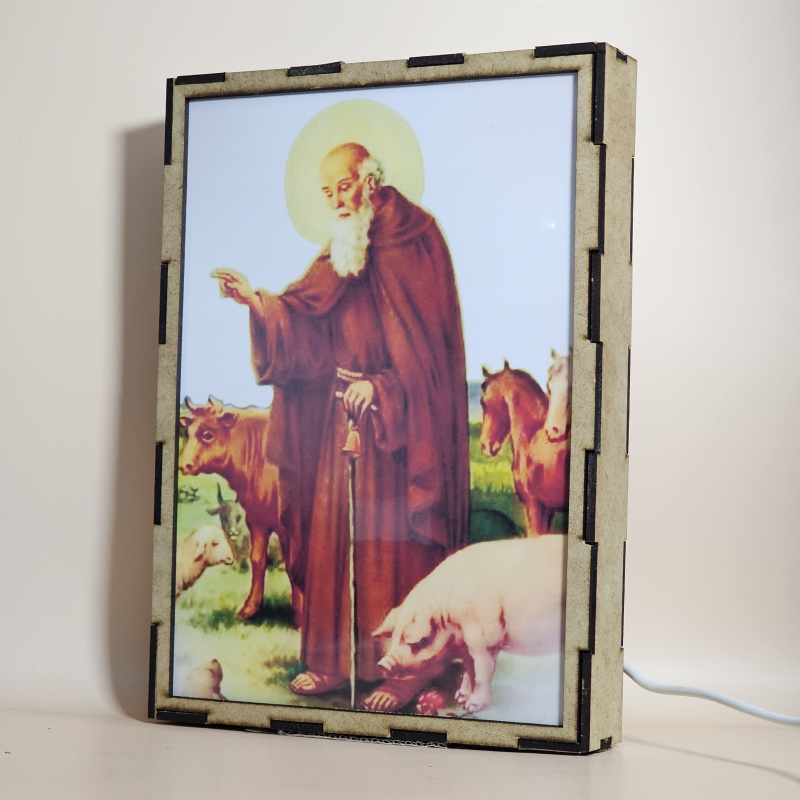 Lámpara con doble imagen  (San Antonio Abad), vista apagada, se esconde la imágen de atras.