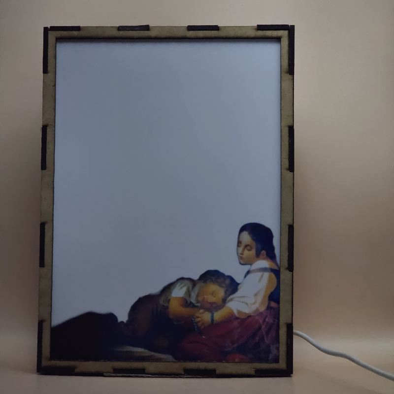 Lámpara con doble imagen  (Ángel de la guarda), vista apagada, se esconde la imágen de atras.