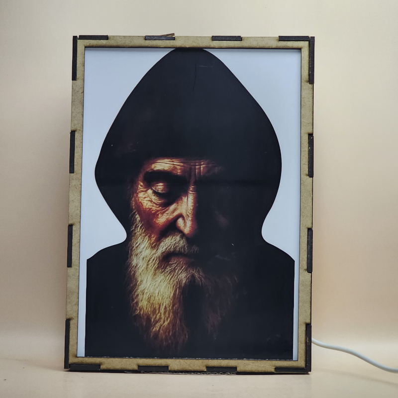 Lámpara con doble imagen  (San Charbel), vista apagada, se esconde la imágen de atras.