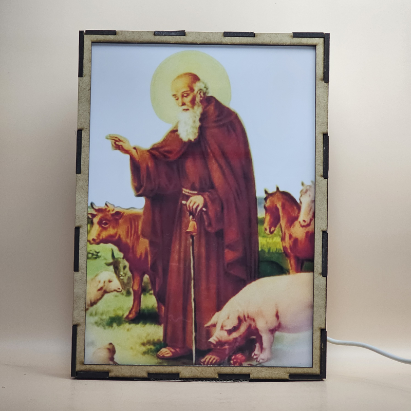 Lámpara con doble imagen  (San Antonio Abad), vista apagada, se esconde la imágen de atras.