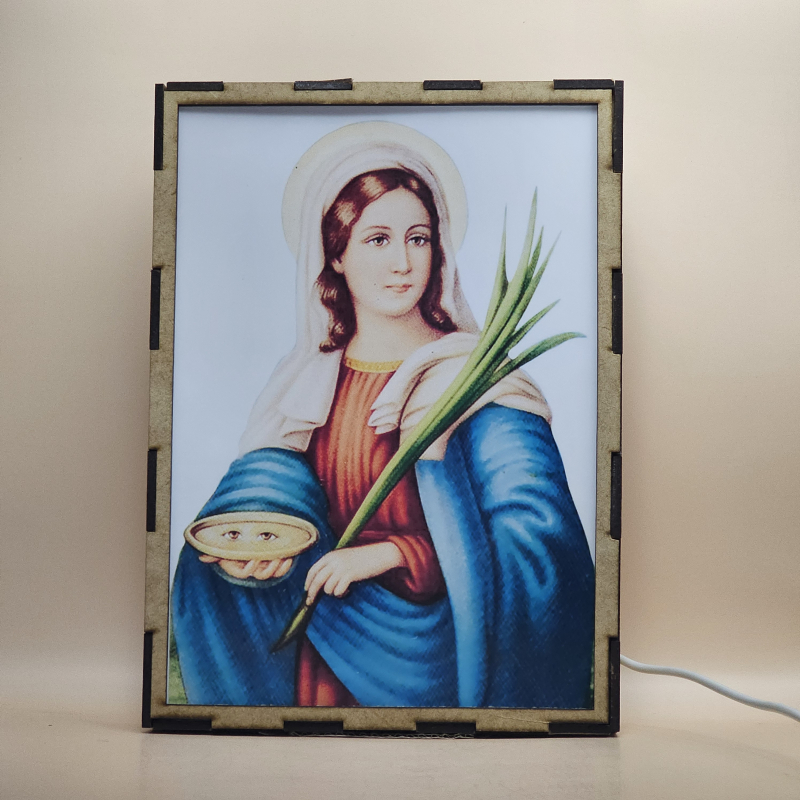 Lámpara con doble imagen  (Santa Lucía), vista apagada, se esconde la imágen de atras.