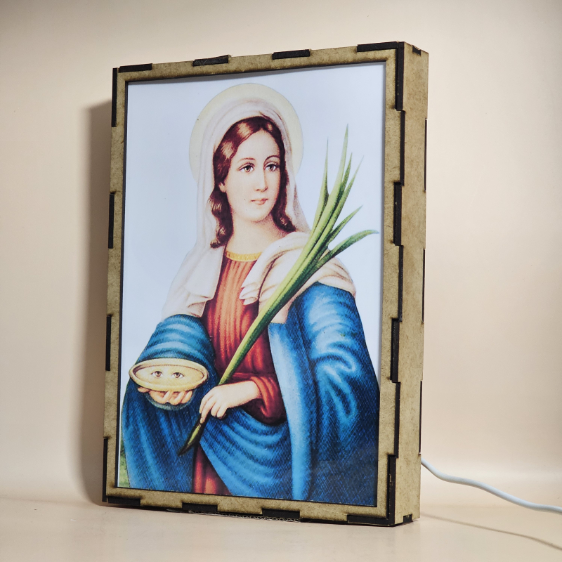 Lámpara con doble imagen  (Santa Lucía), vista apagada, se esconde la imágen de atras.